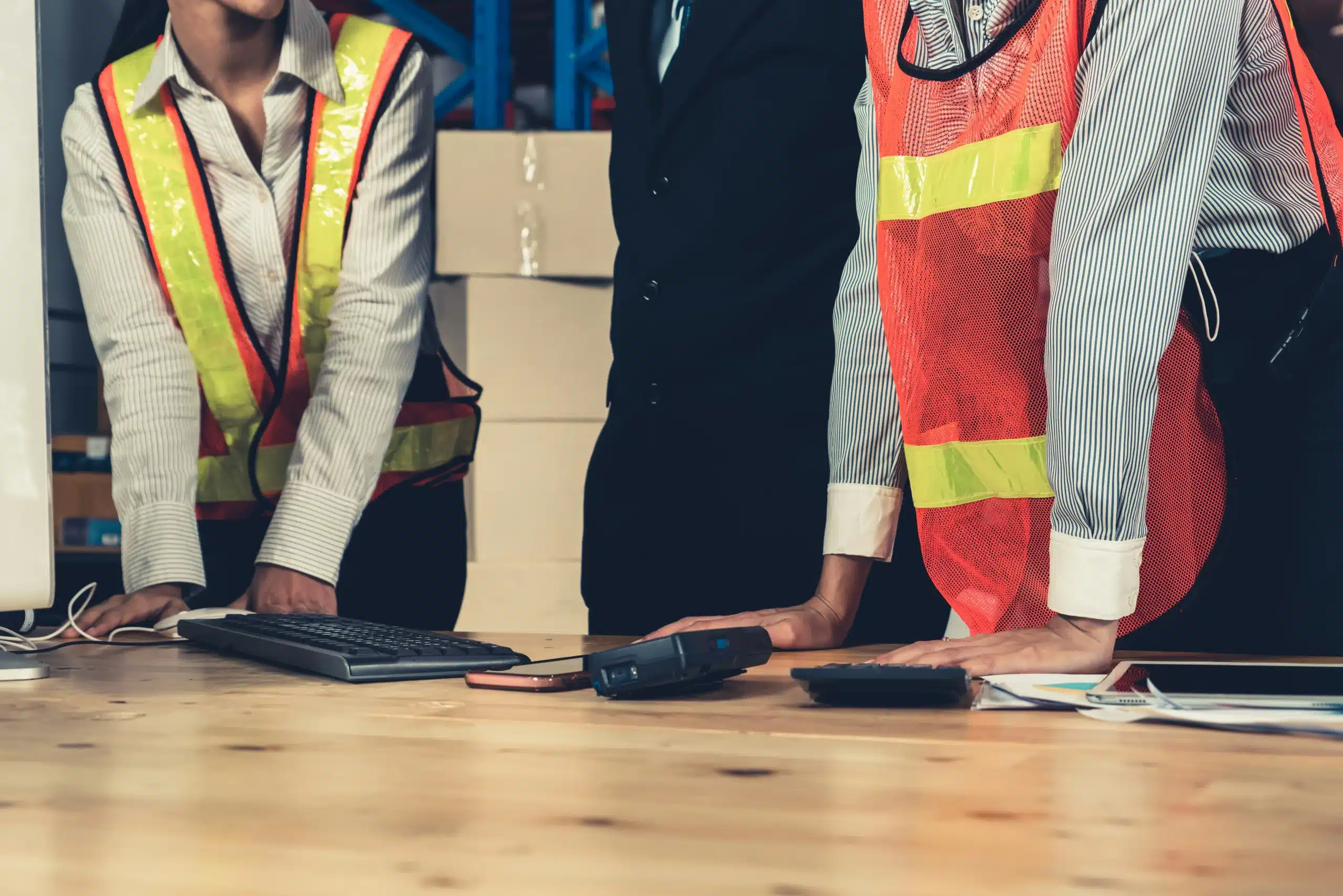 group of people in high vis at a table