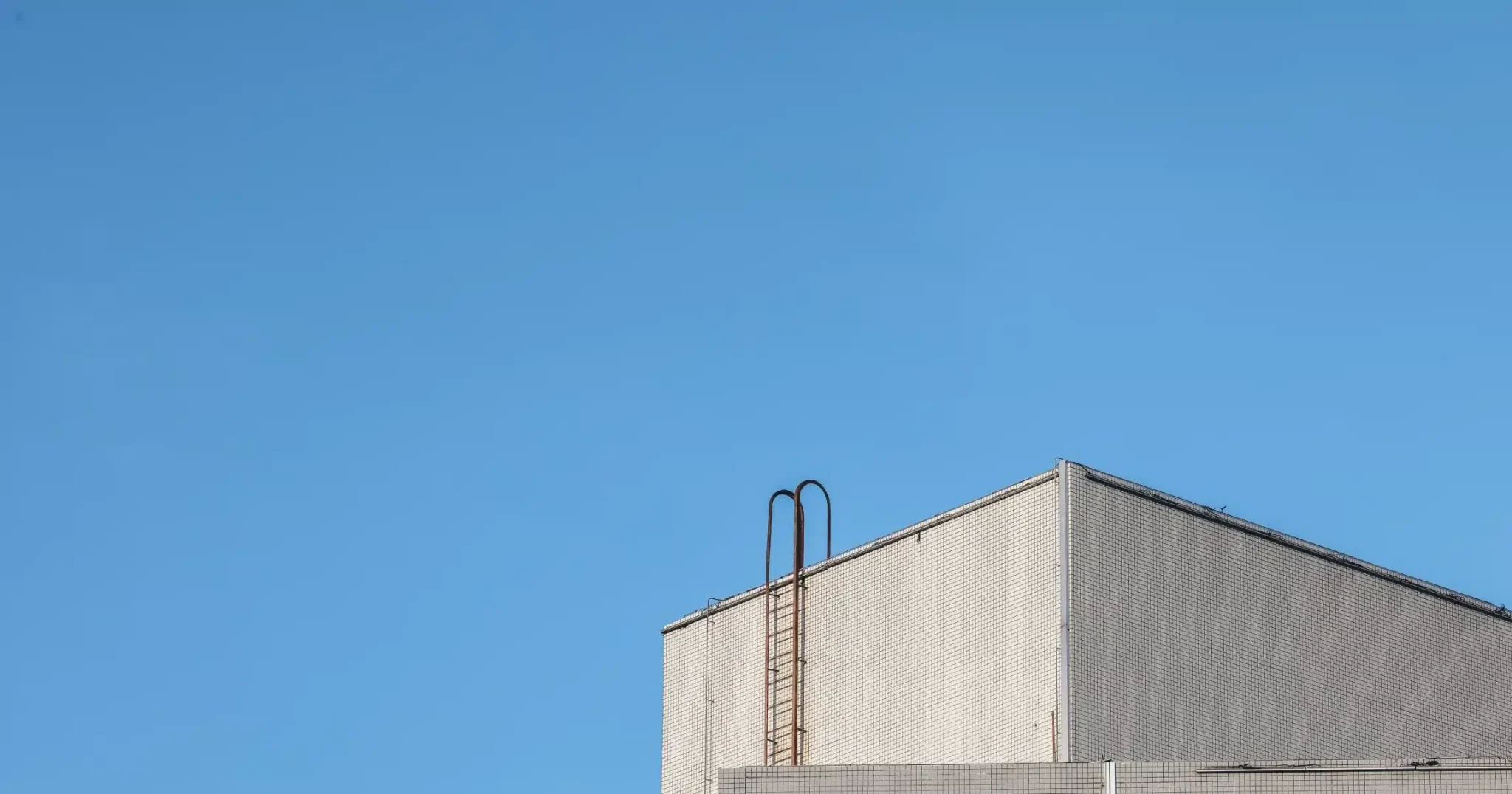 Agrochemicals and pesticides process safety grey factory with blue sky in background